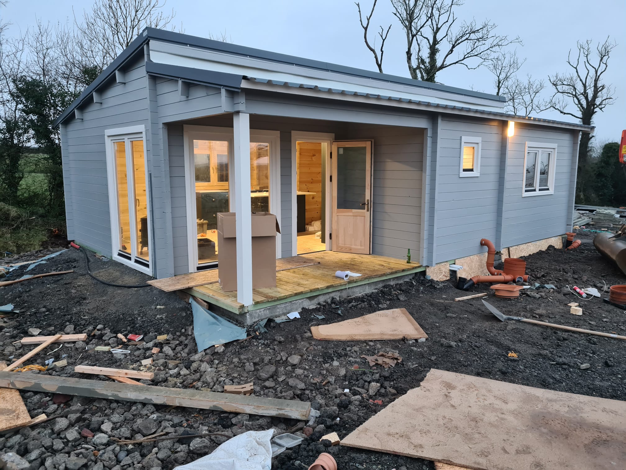 A newly painted modular home built in a back garden