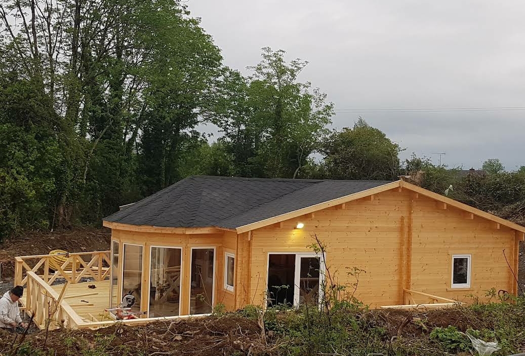 A timber frame home being built